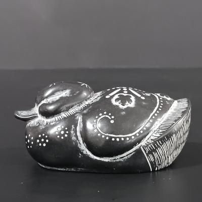 LOT 121: Hand Carved Pearlite Stonecraft Duck, Hexagonal Metal Coin Bank, Carved Stone Game Token & More