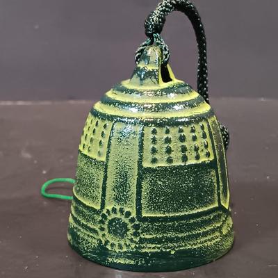 LOT 215: Vintage Straw Travel Case, Cast Iron Wind Chime, Handwoven Rug, Bronze Leaf & More