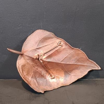 LOT 215: Vintage Straw Travel Case, Cast Iron Wind Chime, Handwoven Rug, Bronze Leaf & More