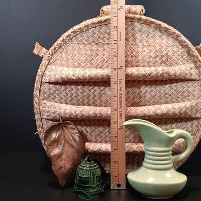 LOT 215: Vintage Straw Travel Case, Cast Iron Wind Chime, Handwoven Rug, Bronze Leaf & More