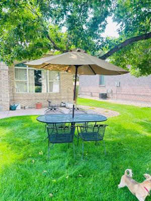VERY NICE OBLONG IRON PATIO TABLE, CHAIRS AND UMBRELLEA