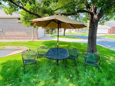 VERY NICE OBLONG IRON PATIO TABLE, CHAIRS AND UMBRELLEA