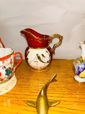 TEA CUPS AND SAUCER’S WITH A BRASS SHARK