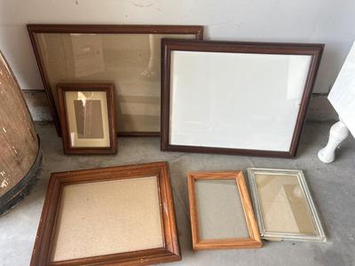 A VARIETY OF DIFFERENT SIZED WOODEN FRAMES