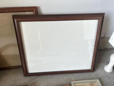 A VARIETY OF DIFFERENT SIZED WOODEN FRAMES
