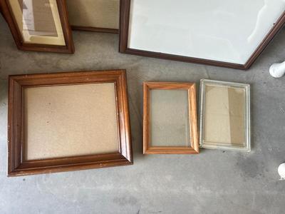 A VARIETY OF DIFFERENT SIZED WOODEN FRAMES