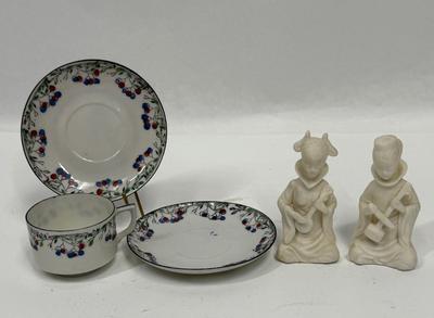 Sale Photo Thumbnail #175: In fair to good used condition. One of the figurines has been reglued on the back of head. And one saucer has small chip.