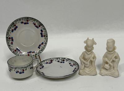 Sale Photo Thumbnail #176: In fair to good used condition. One of the figurines has been reglued on the back of head. And one saucer has small chip.