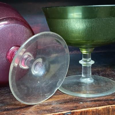 LOT 109: MCM Book Cae with Pink Depression Glassware, Cookbooks & Vintage Plastic Margarita Glasses