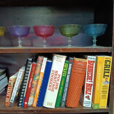 LOT 109: MCM Book Cae with Pink Depression Glassware, Cookbooks & Vintage Plastic Margarita Glasses