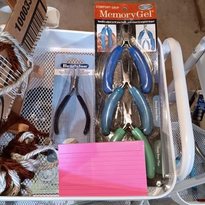 LOT 126: Pair of Metal Trolleys with NIP Pliers, Looms, 80Proof Goods Leather Working Scraps & More