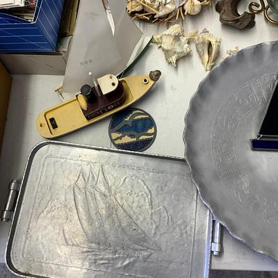 Sale Photo Thumbnail #1160: Pewter trays, stained glass sail boat, small ship model
Large zodiac tray: 16" diameter