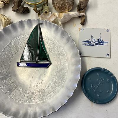 Sale Photo Thumbnail #1163: Pewter trays, stained glass sail boat, small ship model
Large zodiac tray: 16" diameter