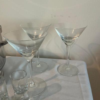 Sale Photo Thumbnail #1246: Decanter, 8 shot glasses, 2 small champagne glasses, 3 martini glasses, ice bucket with tongs (silver plated)
Ice bucket: 9" high x 7.5" wide
Decanter: 11" high
