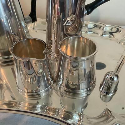 Sale Photo Thumbnail #1262: Comes with snuffer
Tallest pot pitcher: 9" high
Smallest pot pitcher: 8.5" high 
Serving tray: 12" wide x 15" long