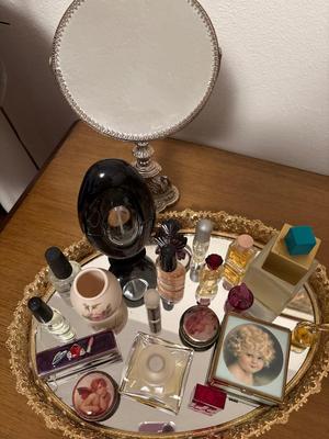 Collectible perfumes, mirror tray, and mirror