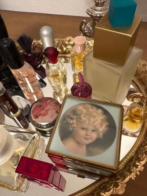 Collectible perfumes, mirror tray, and mirror