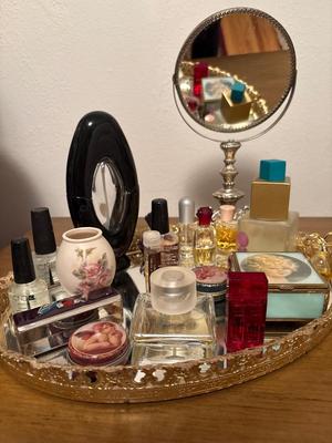 Collectible perfumes, mirror tray, and mirror