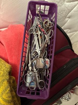 Suitcase, collection of scissors and more