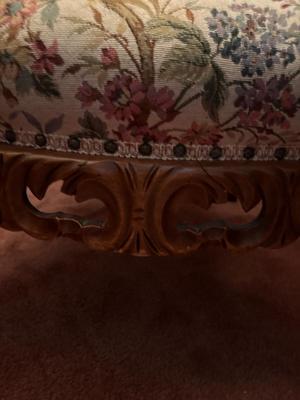 Upholstered, carved wood chair