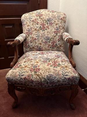 Upholstered, carved wood chair