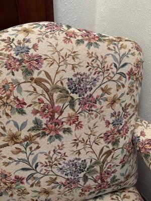 Upholstered, carved wood chair