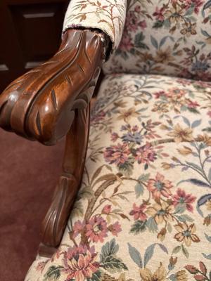 Upholstered, carved wood chair