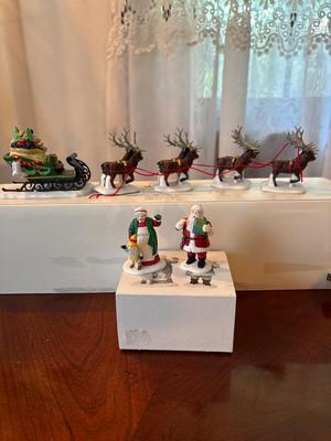 Department 56 Santa and eight reindeer’s and Mr. and Mrs. Claus