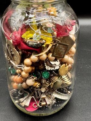 Pint jar of craft jewelry beads and parts