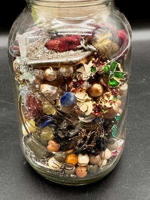 Pint jar of craft jewelry beads and parts