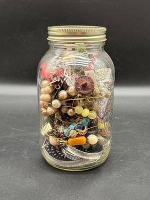 Pint jar of craft jewelry beads and parts