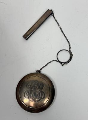 Sale Photo Thumbnail #11: Snap-open lid reveals a mirror inside the lid and a chamber for holding makeup powder. Attached rectangular tube likely held a pencil. Weight is 50.6g. Great condition, no dings or damage.
