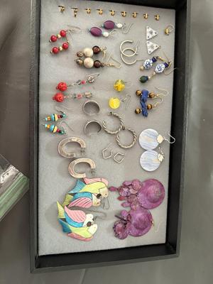Sale Photo Thumbnail #234: This is a great lot of earrings. As you can see in the pictures there is silver chunky earrings and there’s other silver earrings. I’m not sure if they are complete silver or sterling because they’re not marked there’s marble earrings which I thin
