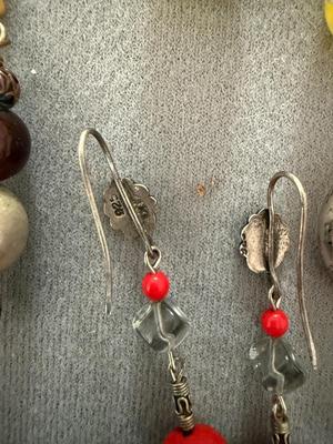 Sale Photo Thumbnail #239: This is a great lot of earrings. As you can see in the pictures there is silver chunky earrings and there’s other silver earrings. I’m not sure if they are complete silver or sterling because they’re not marked there’s marble earrings which I thin