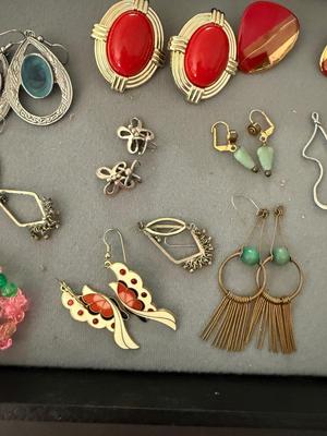 Sale Photo Thumbnail #251: This light has fun Vintage earrings. There’s some big chunky earrings some smaller, beautiful little earrings a lot of 80s style going on here.