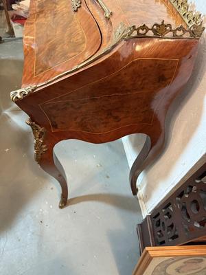 Sale Photo Thumbnail #325: This is suck a beautiful desk. If I had room to keep it, I think it would be mine. This sweet desk has metal senate scrolls to show off its beautiful wood. This would not only make beautiful all around piece in your home but it would make the sweetest van