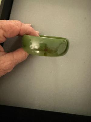 Sale Photo Thumbnail #333: This bracelet tested positive for Bakelite but it was more a brown than yellow color. It’s very pretty. It has a design of a leave and berry inside. It’s very subtle.