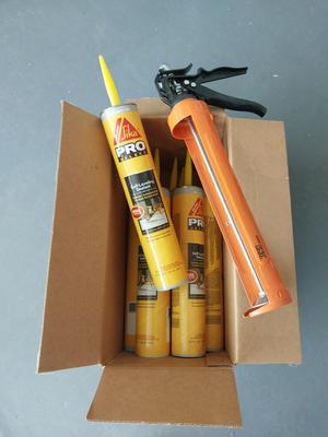 BOX OF PRO SELF LEVELING SEALENT AND CAULKING GUN