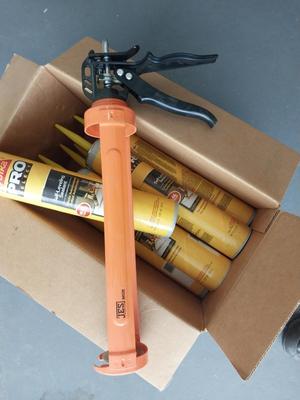 BOX OF PRO SELF LEVELING SEALENT AND CAULKING GUN