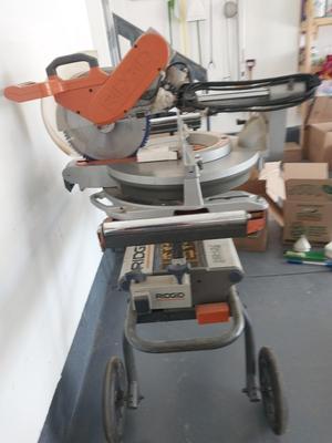 RIDGID DUEL BEVEL SLIDING MITER SAW ON MOBIL STAND