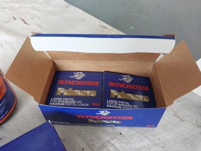 TWO WINCHESTER PREMERS AND BOTTLE BALL POWDER