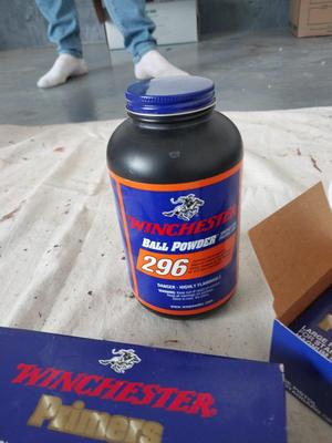 TWO WINCHESTER PREMERS AND BOTTLE BALL POWDER