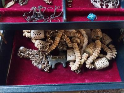 JEWELRY BOX WITH TWO STERLING CHAINS AND OTHER TRINKETS