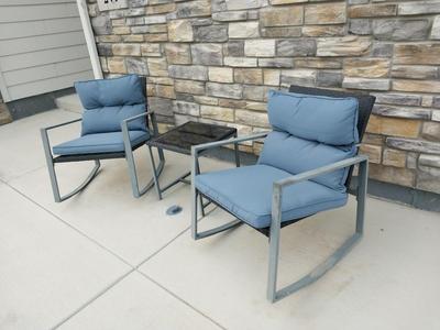 TWO RESIN CHAIRS AND SMALL RESIN TABLE WITH CUSHIONS