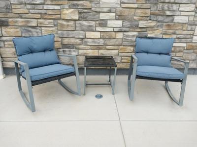 TWO RESIN CHAIRS AND SMALL RESIN TABLE WITH CUSHIONS