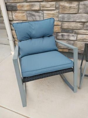 TWO RESIN CHAIRS AND SMALL RESIN TABLE WITH CUSHIONS