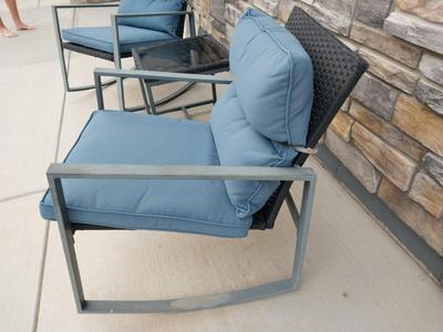 TWO RESIN CHAIRS AND SMALL RESIN TABLE WITH CUSHIONS