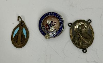 Sale Photo Thumbnail #108: 15 Year service pin for St. Joseph's Hospital, Sterling Silver Madonna medallion (2.6gh), and a Miraculous Medal from France.