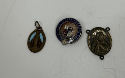 Sale Photo Thumbnail #110: 15 Year service pin for St. Joseph's Hospital, Sterling Silver Madonna medallion (2.6gh), and a Miraculous Medal from France.