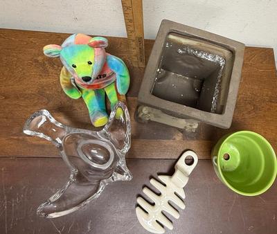 Sale Photo Thumbnail #371: Rainbow bear plush, glass dove spoon rest, square planter, small green pot, and a replacement insert for a bacon maker by Louisville Stoneware.